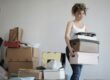 overwhelmed woman moving boxes