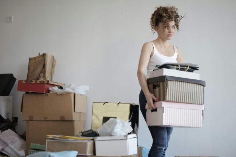 overwhelmed woman moving boxes